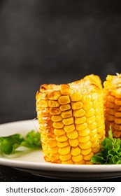 Grilled corn cob vegetable dish corn snack food preparation tasty snack fresh, delicious gourmet food background on the table rustic food top view copy space keto and paleo diets vegetarian and vegan food