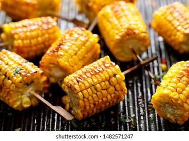 Grilled Corn On The Cob With Butter And  Salt  On The Grill Plate, Close-up