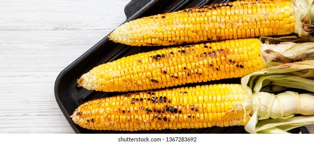 Grilled Corn On The Cob In A Grilling Pan, Overhead View. Flat Lay, From Above, Top View.