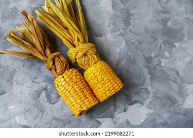 Grilled Corn On The Cob Over White Wooden Surface, Top View. Summer Food. From Above, Overhead, Flat Lay. Close-up.