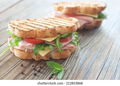 Grilled deli sandwiches with ham and cheese 