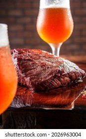 Grilled Denver Steak On Wooden Cutting Board With Sweaty Tulipa Glasses Of Draft Ale Beer. Marble Meat Beef.