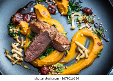 Grilled Duck Breast With Vegetables, Mushrooms And Yellow Potato Purée