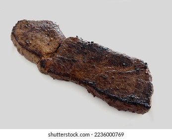 Grilled elk steaks against a white background. - Shutterstock ID 2236000769