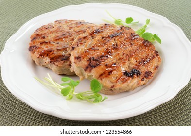 Grilled extra lean turkey burgers brushed with sweet chili sauce