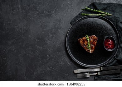 Grilled Filet Mignon Steak. Beef Tenderloin. Black Background. Top View. Space For Text