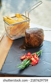 Grilled Fillet Mignon And French Fries On Slate Plate