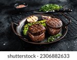 Grilled Fillet Mignon Steak with roasted asparagus. Black background. Top view.