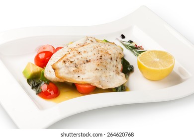 Grilled Fish Fillet On A White Plate