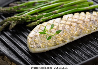 Grilled Fish With Green Asparagus On Frying Pan