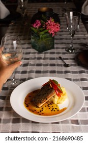 Grilled Fish Loin On Mashed Potatoes And Passion Fruit Sauce