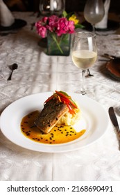 Grilled Fish Loin On Mashed Potatoes And Passion Fruit Sauce