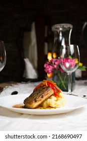 Grilled Fish Loin On Mashed Potatoes And Passion Fruit Sauce