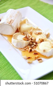 Grilled Goat Cheese With Honey And Pine Nuts