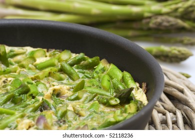 Grilled Green Asparagus Omelette In A Pan Close-up