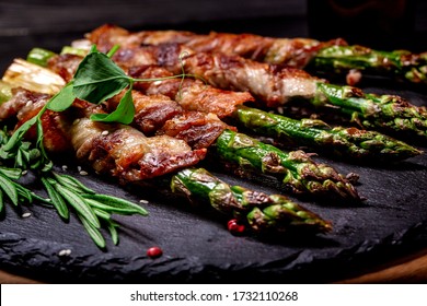 Grilled green asparagus wrapped with bacon. Ketogenic diet. Healthy food, diet menu. Top view, overhead, banner.