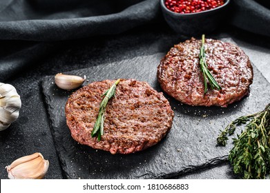 Grilled Ground Beef Patties. BBQ Meat. Black Background. Top View