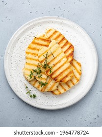 Grilled Halloumi Cheese On A White Ceramic Plate, Top View