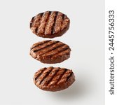 Grilled hamburger patties falling on white background. Delicious Grilled burger patties floating.