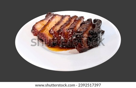 Grilled honey sweet pork on white plate isolated blank background.