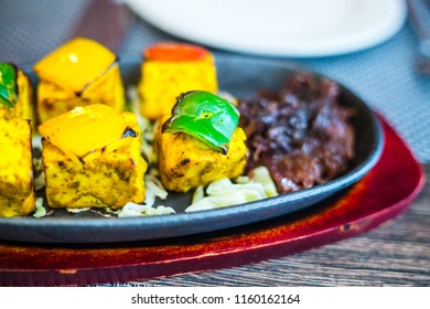 Grilled Indian Cheese With Pepper And Caramelized Onion In Luxury Indian Restaurant