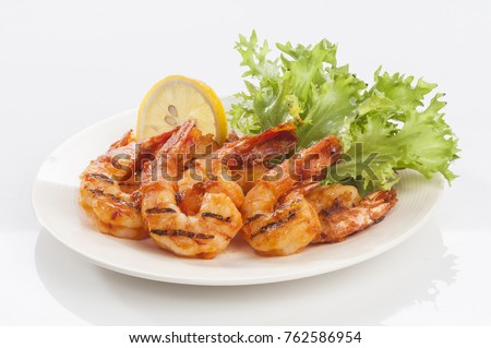 Grilled Jumbo headless shrimp with tikka marinade with lemon tomato and lettuce  