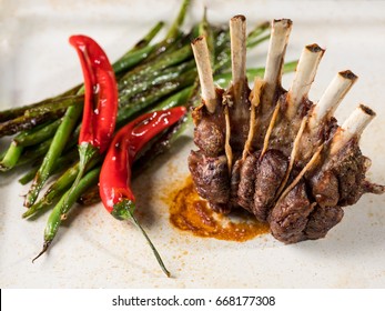 Grilled lamb meat  ribs on white plate background. top view food photo.
