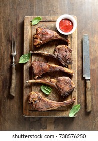 Grilled Lamb Steak  On A Wooden Background.Top View