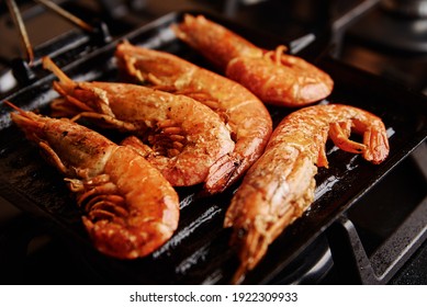 Grilled Large Shrimps With Lemon And Spices On Grill Pan