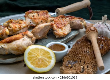 Grilled Lemon Herb Chicken Thighs On Metal Skewers With Honey Served On Ceramic Plate. BBQ Chicken Skewers Marinade Ready To Eat, Selective Focus.