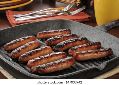 Grilled Link Sausage In A Cast Iron Pan