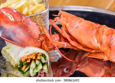 Grilled Lobster Tail With French Fries And Spring Rolls