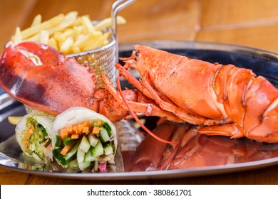 Grilled Lobster Tail With French Fries And Spring Rolls