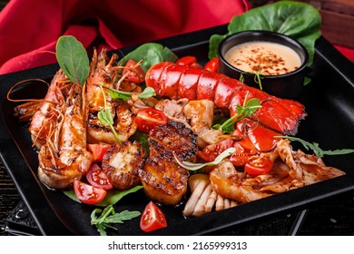 Grilled Lobster Tail With Seafood Shrimp Scallops Clams Tomato Salad 