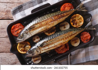 Grilled Mackerel Fish On A Grill Pan Closeup. Horizontal View From Above
