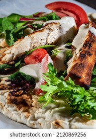 Grilled Mahi Mahi Fish On Pita Bread With Dressing