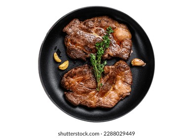 Grilled marble meat steaks Chuck eye roll in a pan. Isolated on white background