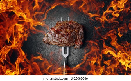 grilled marbled beef steak and fire