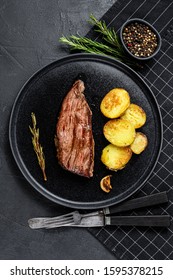 Grilled Marinated Beef Flank Steak. Black Background. Top View.