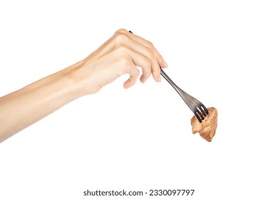 Grilled meat in female hand on fork isolated on white background. High quality photo - Powered by Shutterstock