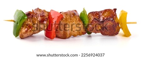 Grilled meat skewers, roasted shish kebab with onion and tomatoes, isolated on white background