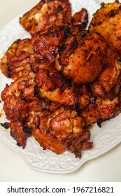 Grilled Memphis Rubbed Skinless Boneless Chicken Thighs On Server Dinner Platter