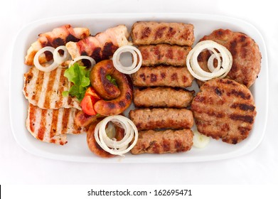 Grilled Mixed Meat Party Platter. Overhead Studio Shot On White