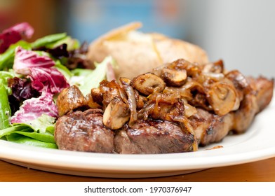 Grilled New York Strip Steak With Salad And Baked Potato