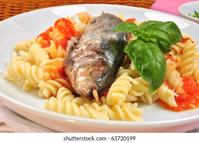 Grilled Organic Sardine On Some Tomato Pasta