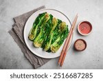 Grilled Pak Choi or Bok Choy on a gray background, top view