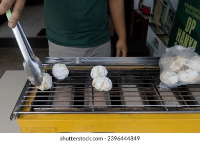 Grilled Pempek is a snack that is popular in many regions in Indonesia - Shutterstock ID 2396444849
