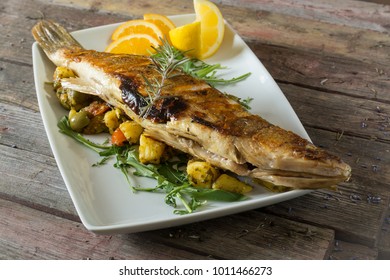 Grilled Perch On A Plate. On A Wooden Background. Rustic Food