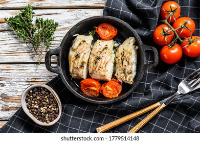 Grilled Pollock Or Coalfish Fillets In A Pan. White Background. Top View