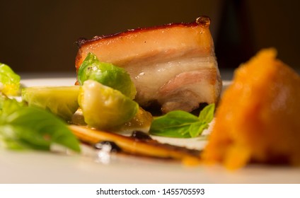 Grilled Pork Accompanied By Baby Vegetables And Sweet Potato Puree